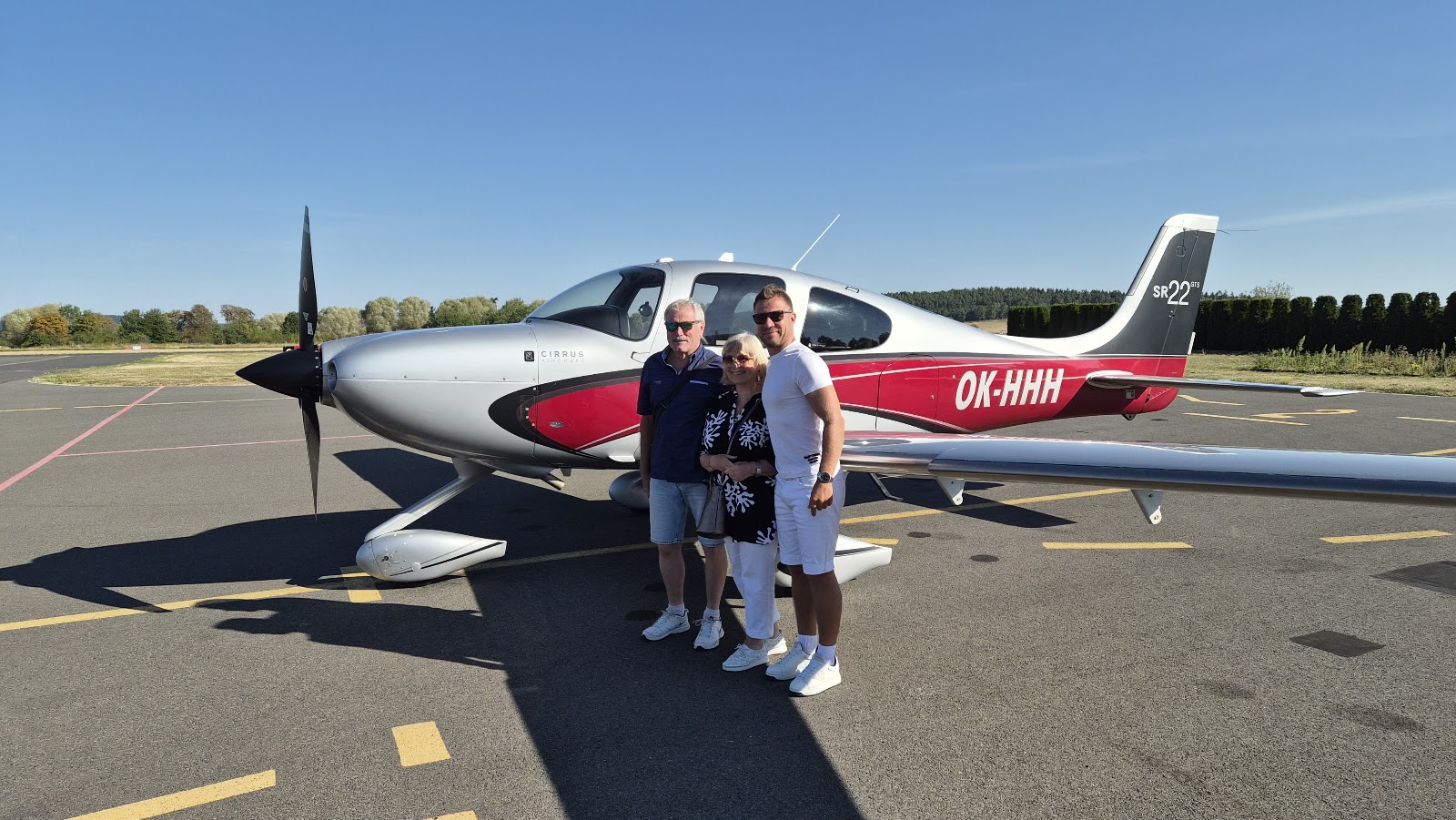 Cirrus SR22 on the apron with passengers