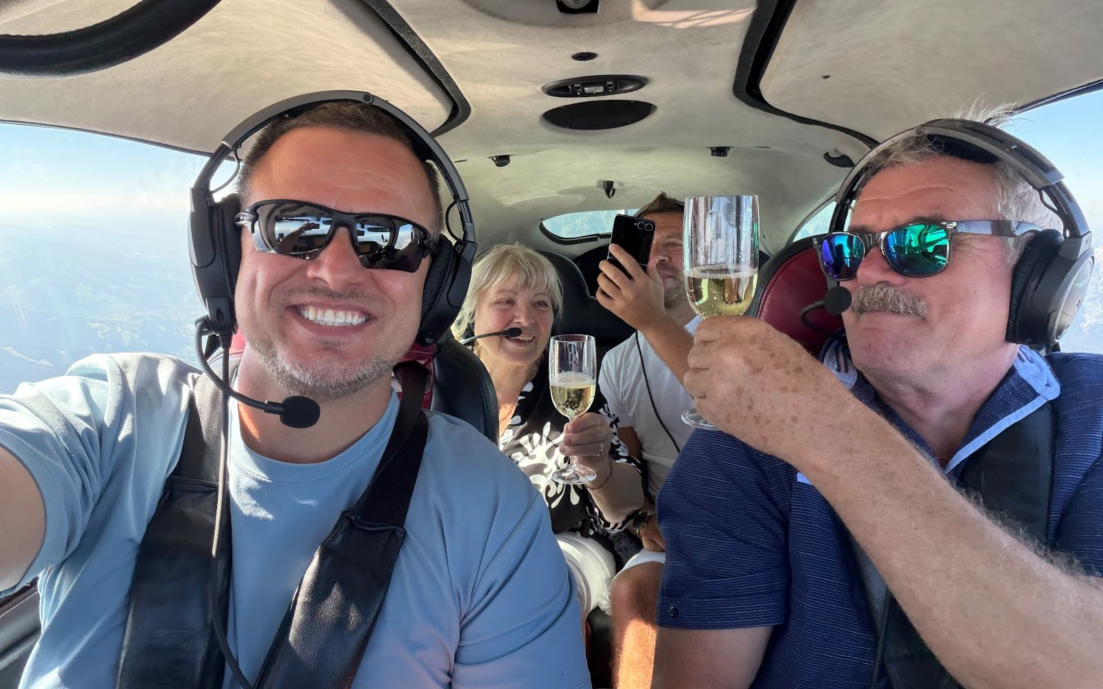 Pilot and passengers in the cabin in flight