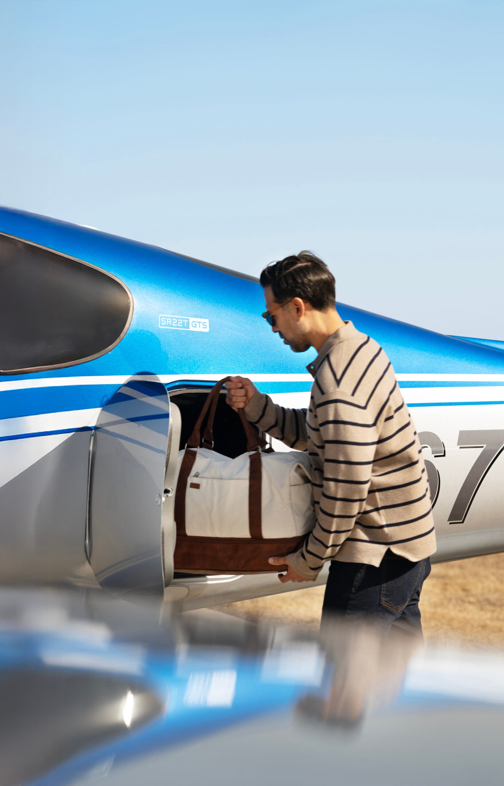Loading a bag through the baggage door
